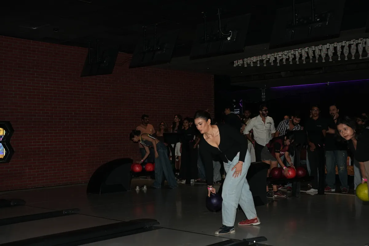 Bowlers and a crowd of guests at Strike Social